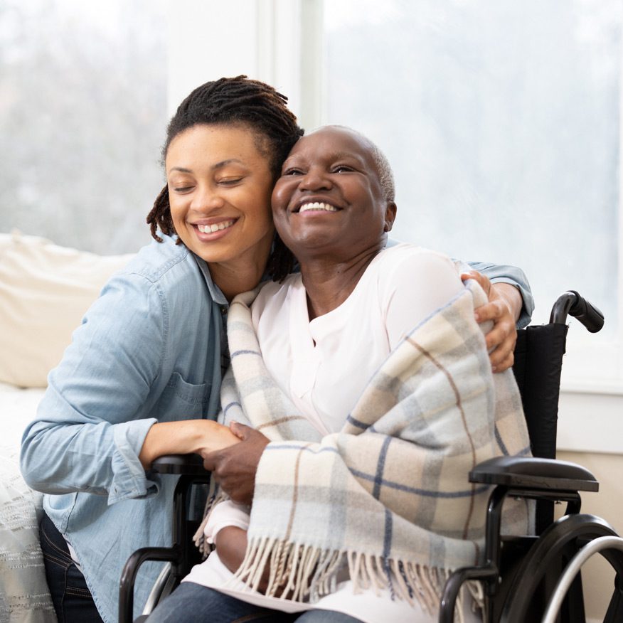 Caregiver-providing-home-care-to-female-senior
