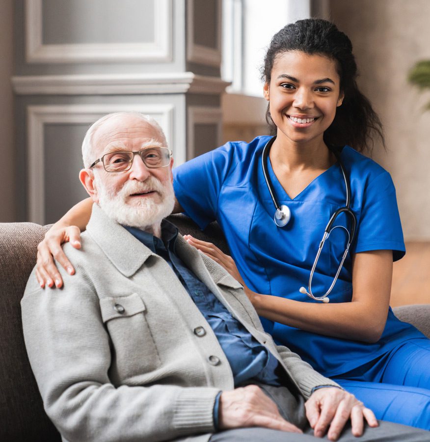 Female-nurse-caring-for-an-elderly-man-at-a-nursing-home