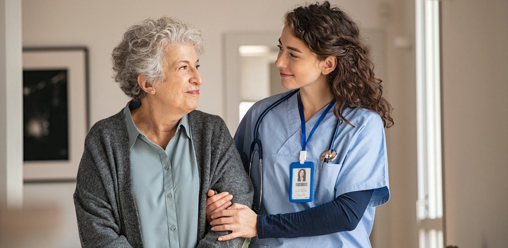 Senior-woman-receiving-care-at-a-nursing-home