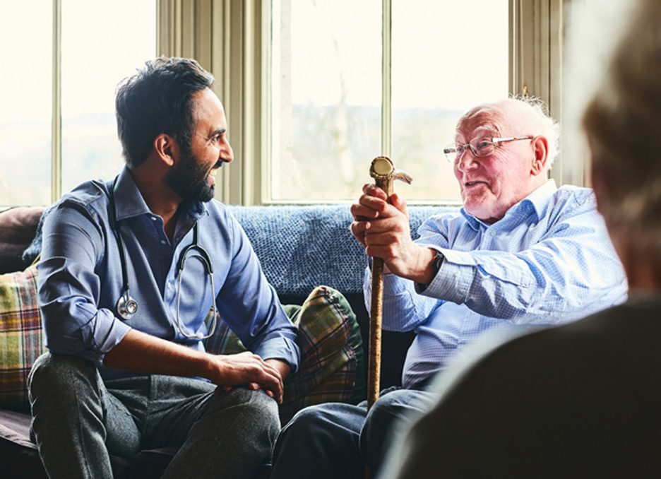 Doctor-speaking-to-elderly-man-at-a-nursing-home-in-Ventura-County
