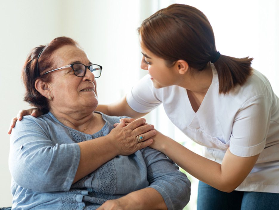 Nurse-speaking-to-elderly-woman-at-a-nursing-home-in-Los-Angeles