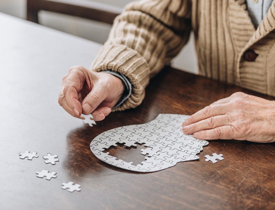 Senior-man-working-on-puzzle-at-facility-offering-memory-care-in-Camarillo