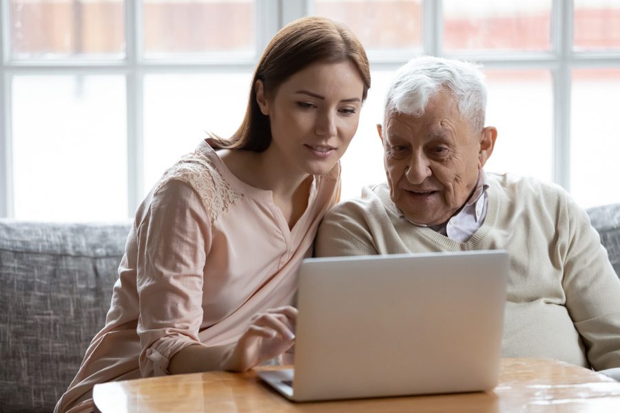 Seniors-daughter-reviewing-online-accounts