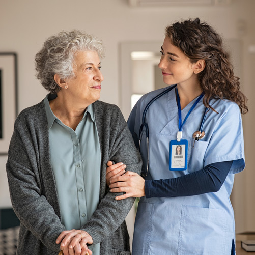 Caregiver-assisting-woman-at-assisted-living-in-Los-Angeles Caregiver-assisting-woman-at-assisted-living-in-Los-Angeles
