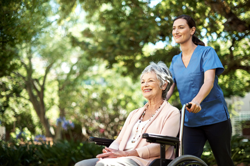 Elderly-woman-enjoying-time-outdoors-at-a-nursing-home-in-Ventura-County Elderly-woman-enjoying-time-outdoors-at-a-nursing-home-in-Ventura-County