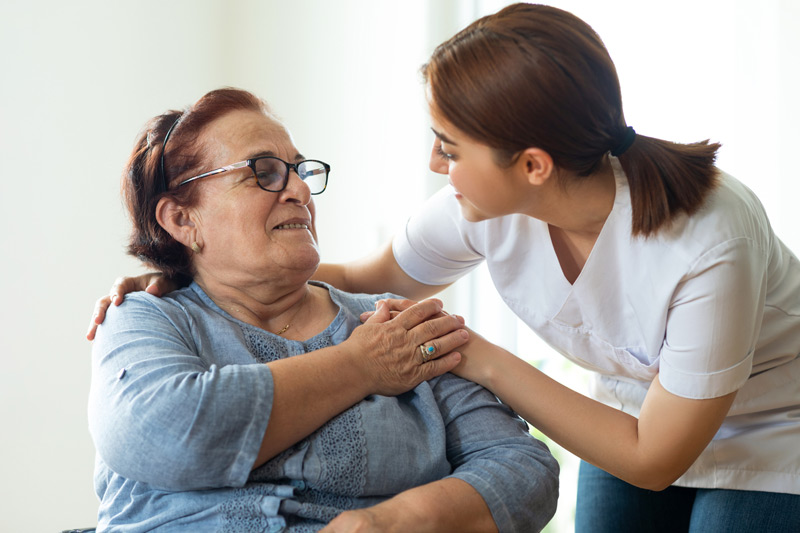 Nurse-speaking-to-elderly-woman-at-a-nursing-home-in-Los-Angeles Nurse-speaking-to-elderly-woman-at-a-nursing-home-in-Los-Angeles