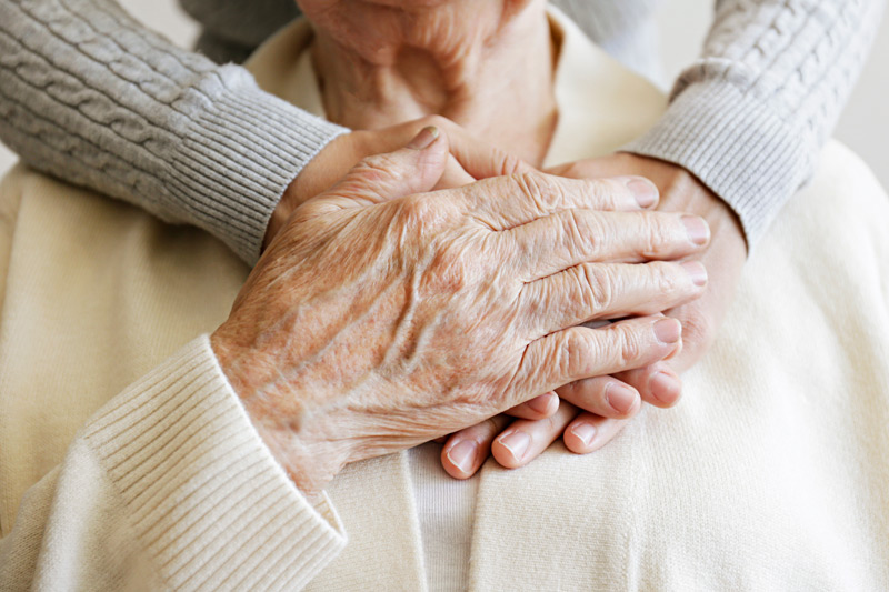 Senior-woman-embraced-by-nurse-at-assisted-living-in-Camarillo Senior-woman-embraced-by-nurse-at-assisted-living-in-Camarillo