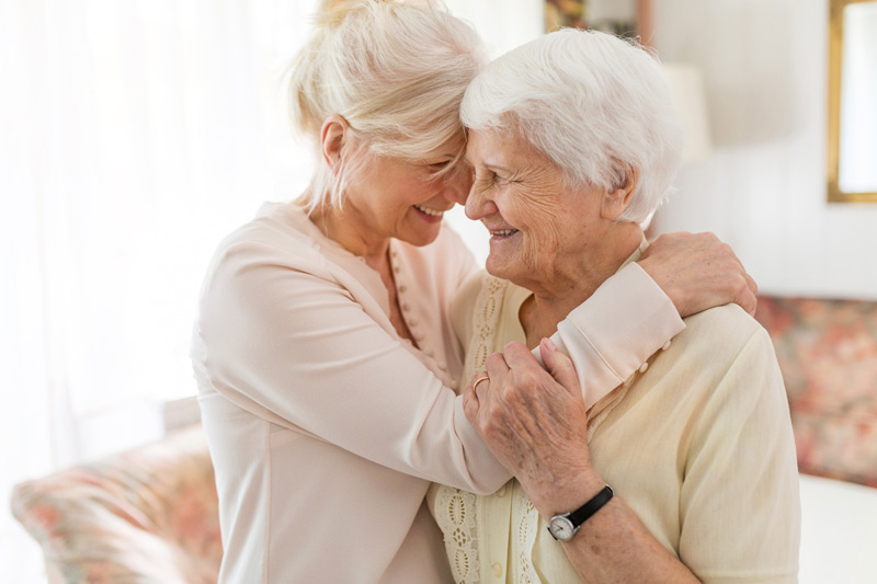Senior-woman-hugging-daughter-and-needing-care-from-nursing-home-in-The-Valley Senior-woman-hugging-daughter-and-needing-care-from-nursing-home-in-The-Valley