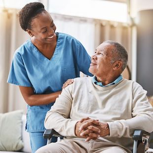 Help, support and wheelchair with nurse and old man for disability, rehabilitation or healing. Retirement, physiotherapy and healthcare with patient and black woman nursing home for medical caregiver